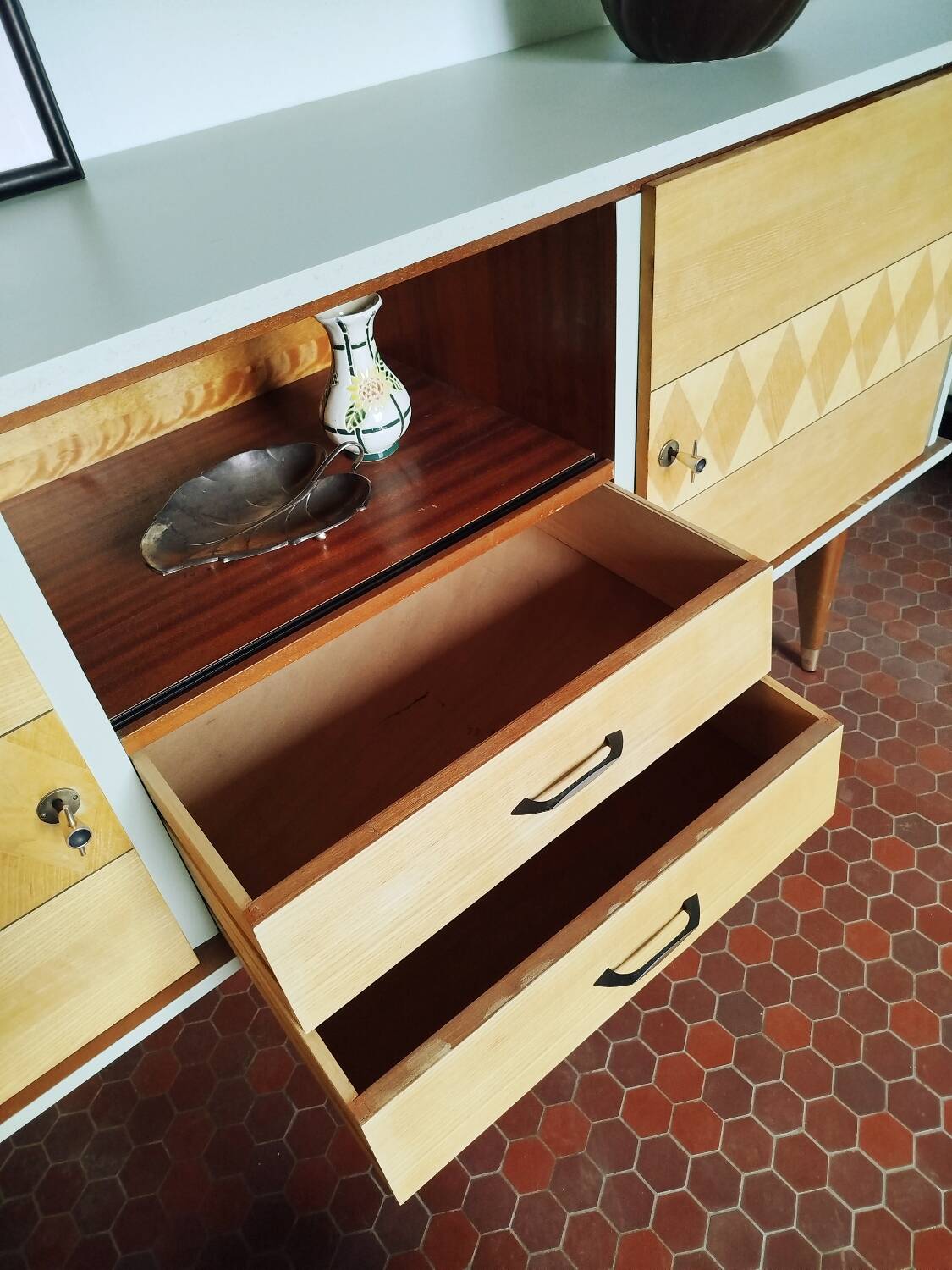Wooden sideboard in soft green