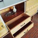 Wooden sideboard in soft green