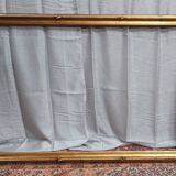 Old frame in wood and gilded stucco