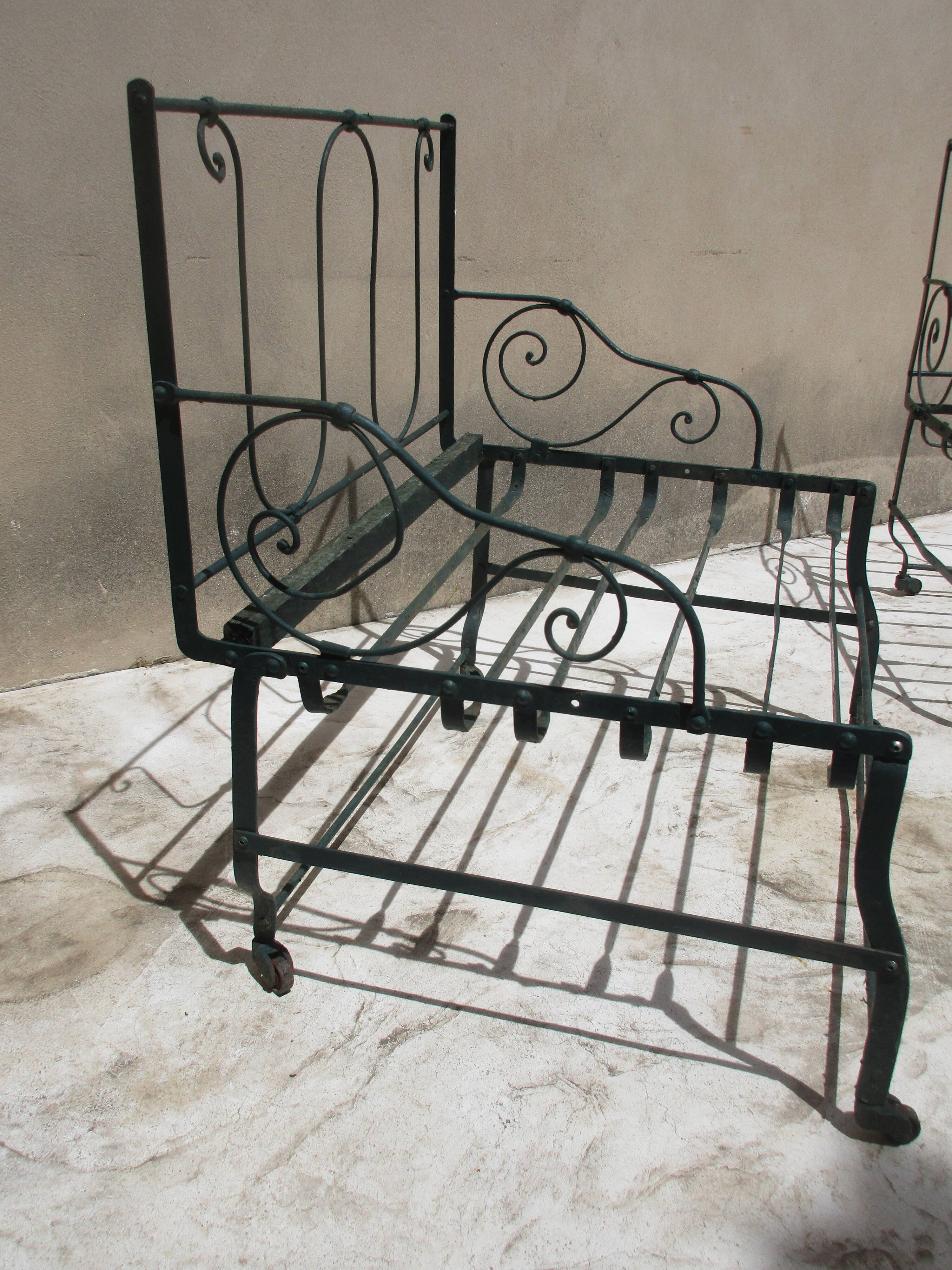 Pair of iron garden chairs forge