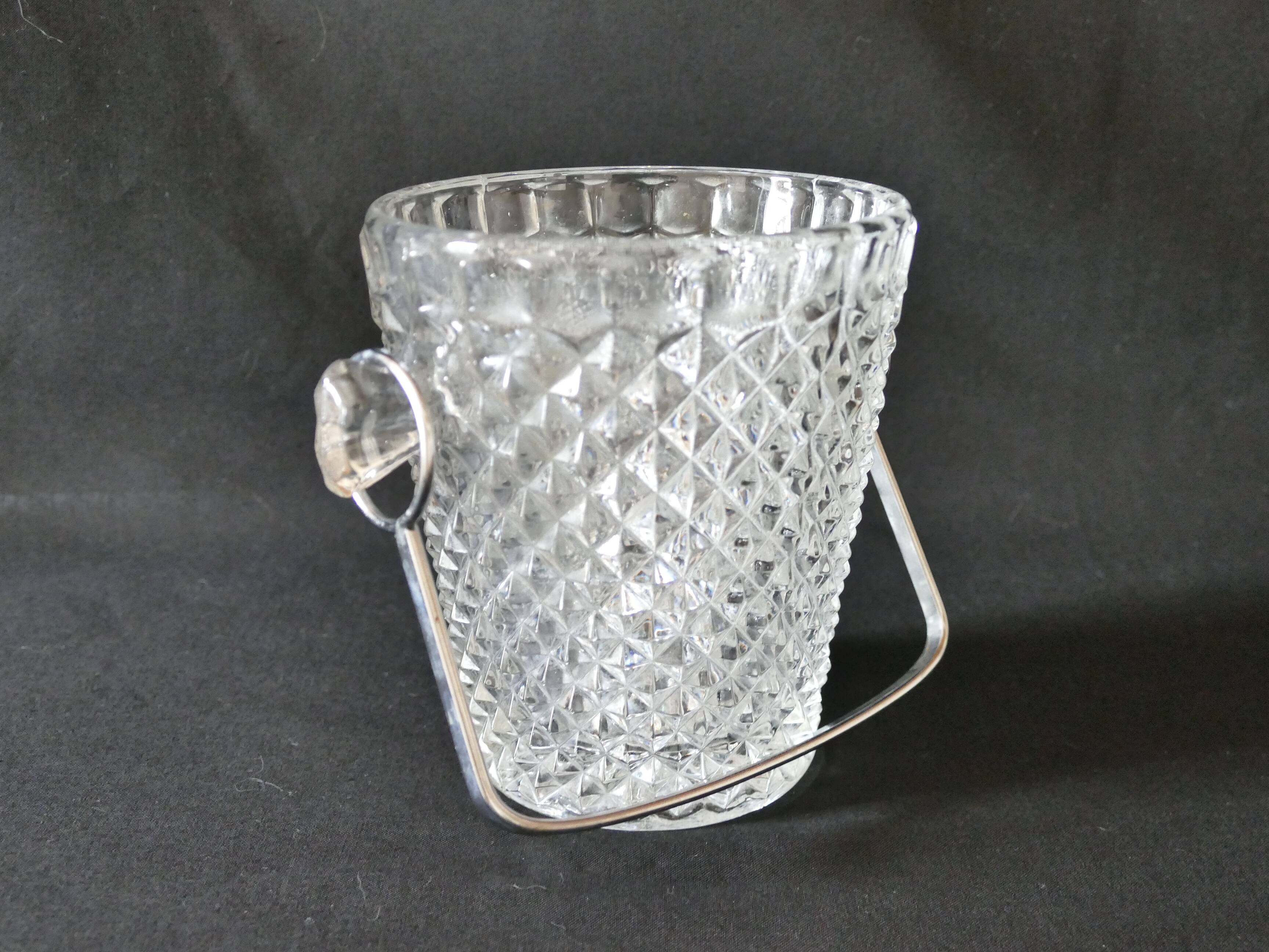Vintage glass ice bucket stamped with a metal handle