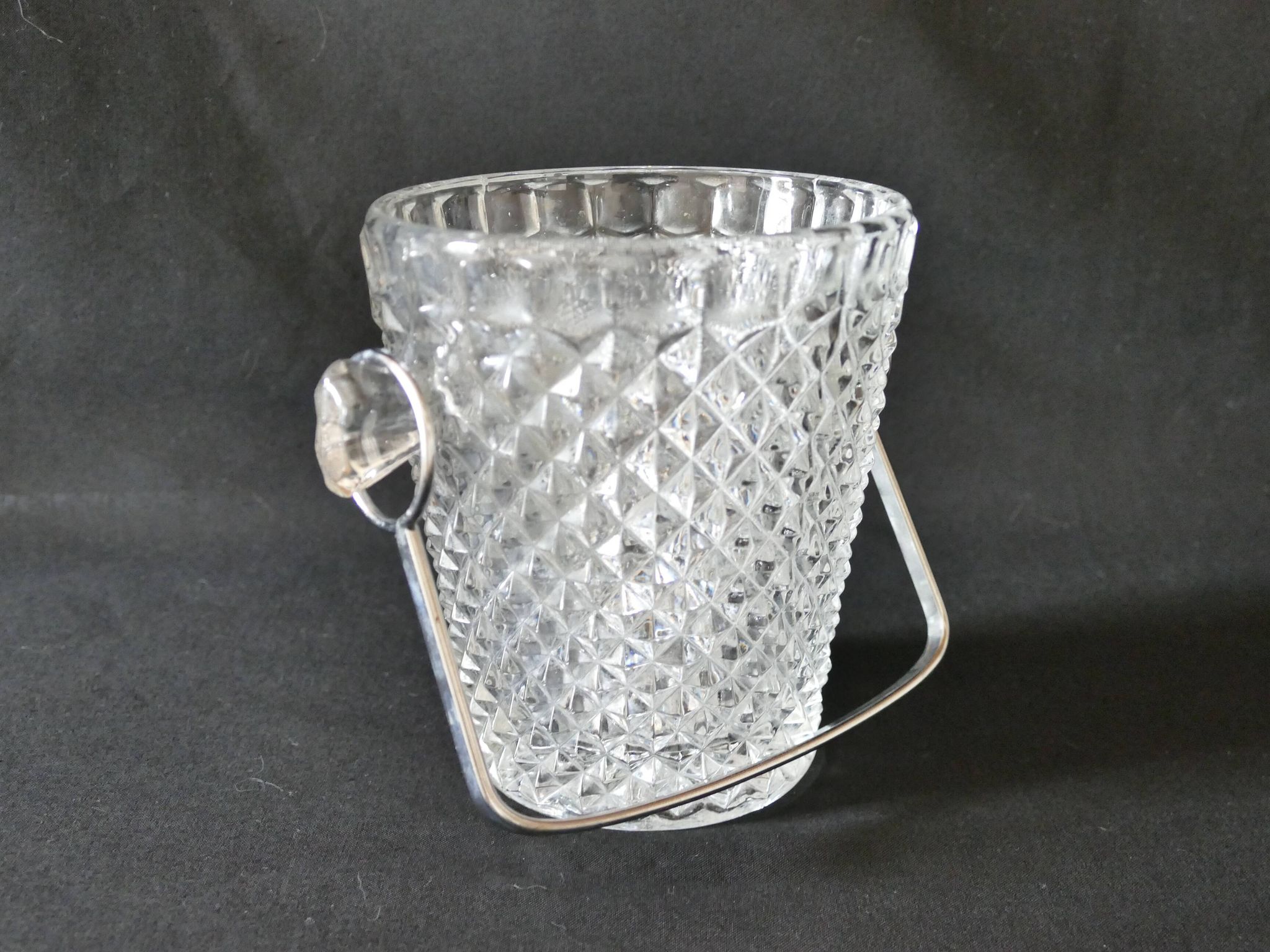 Vintage glass ice bucket stamped with a metal handle