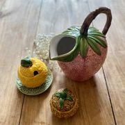 Set of ceramic fruits, a strawberry decanter and two lemon and pineapple jam jars