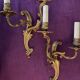 Pair of gilded bronze wall lights, 1950