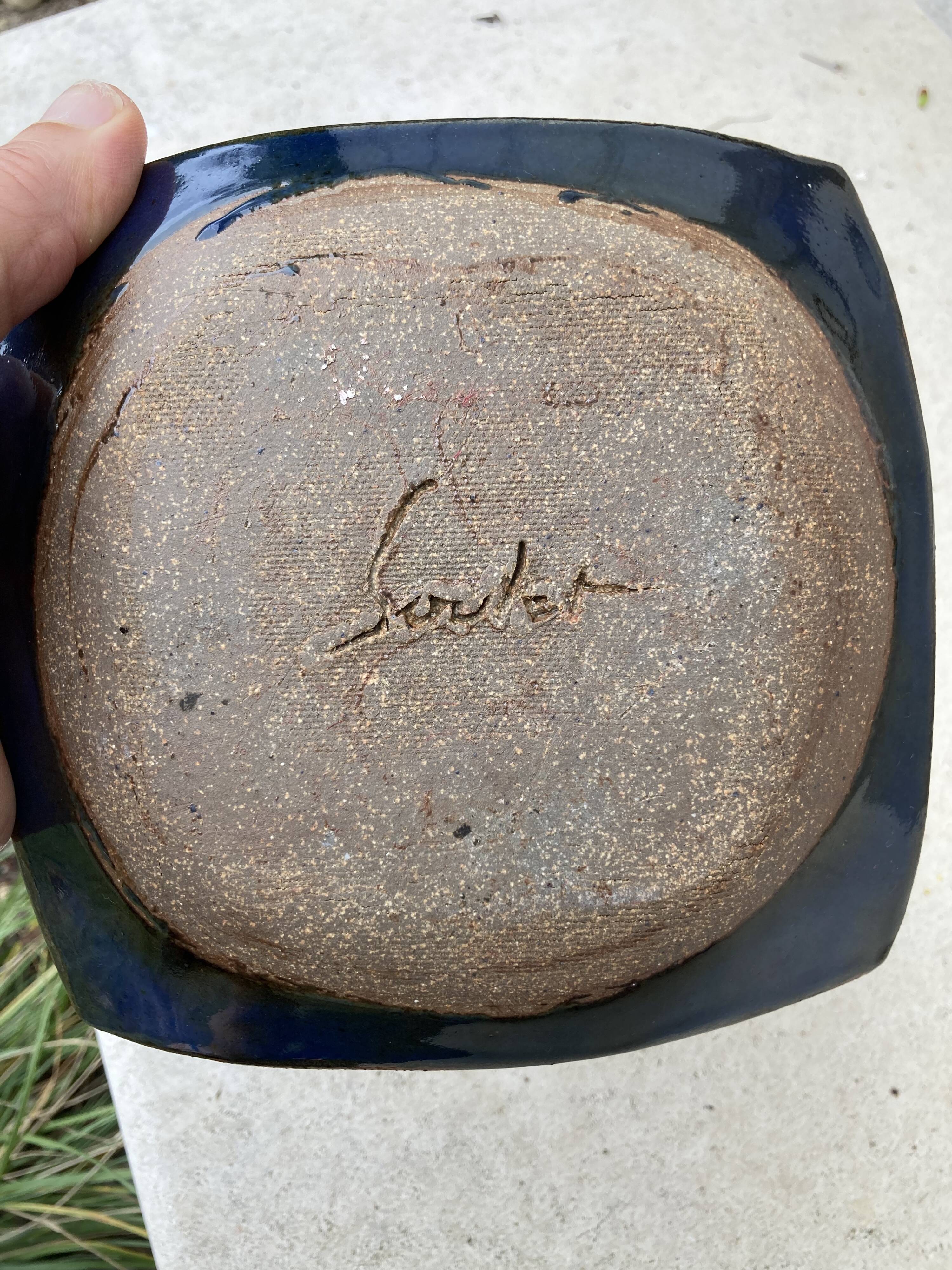 Empty terracotta pocket / ashtray