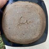 Empty terracotta pocket / ashtray