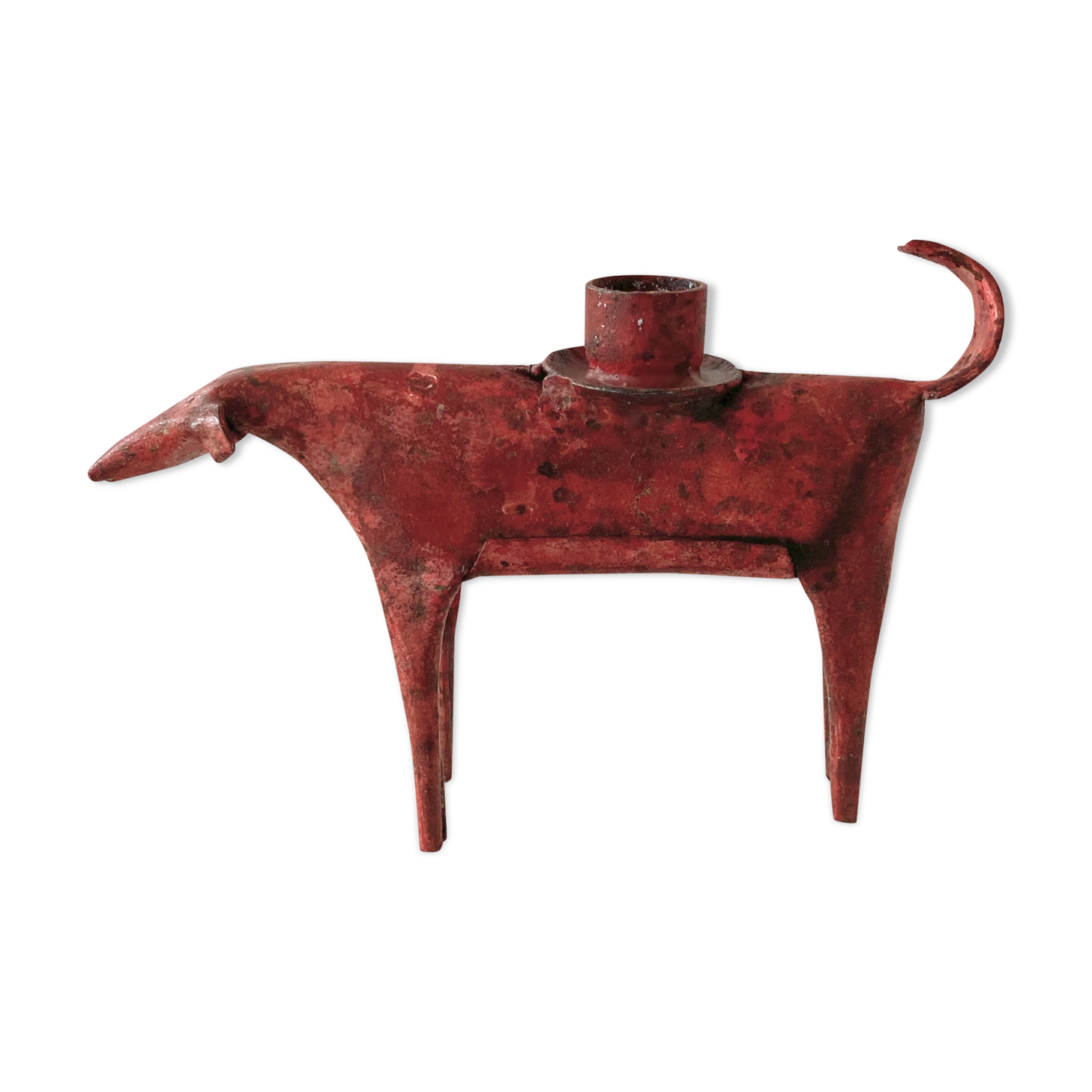 Zoomorphic candlestick made of red metal