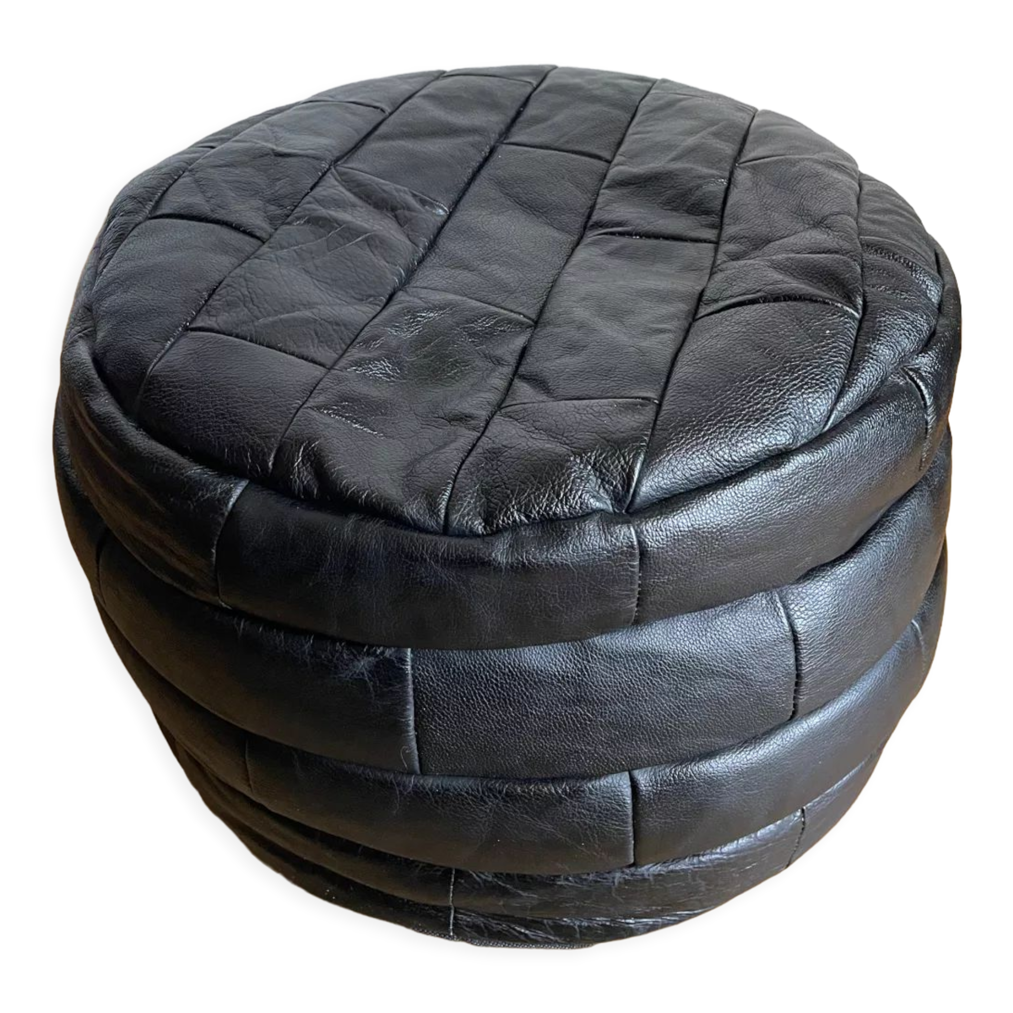 Patchwork black leather pouf de Sède