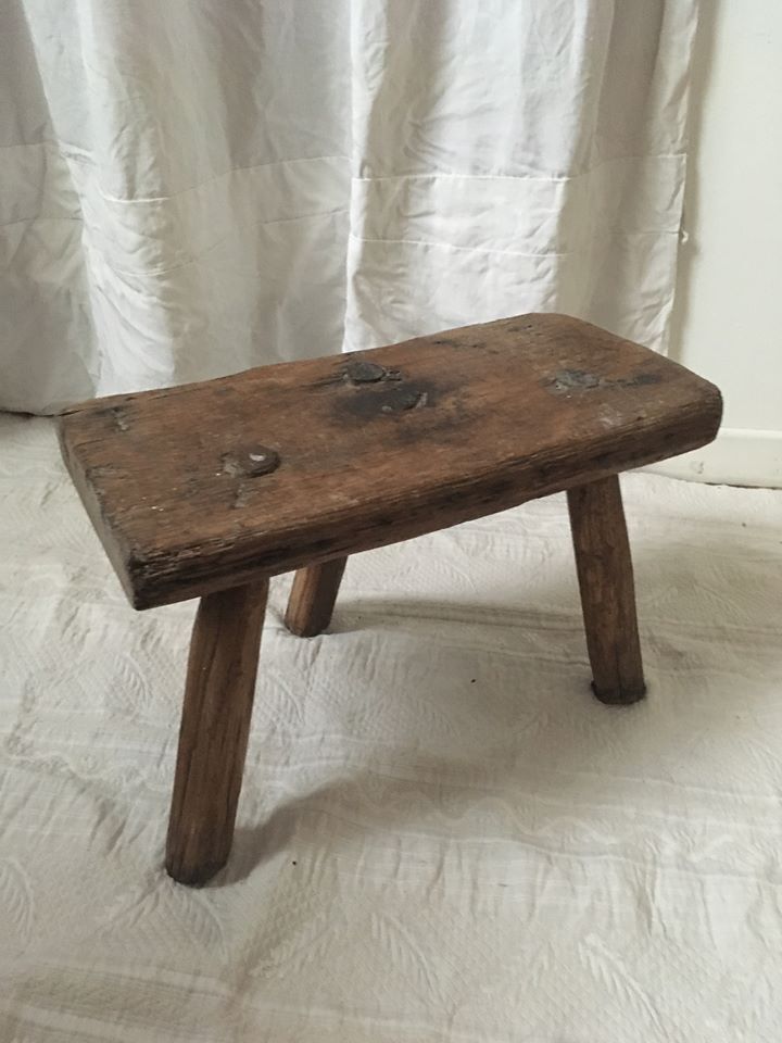 Crude wooden tripod stool