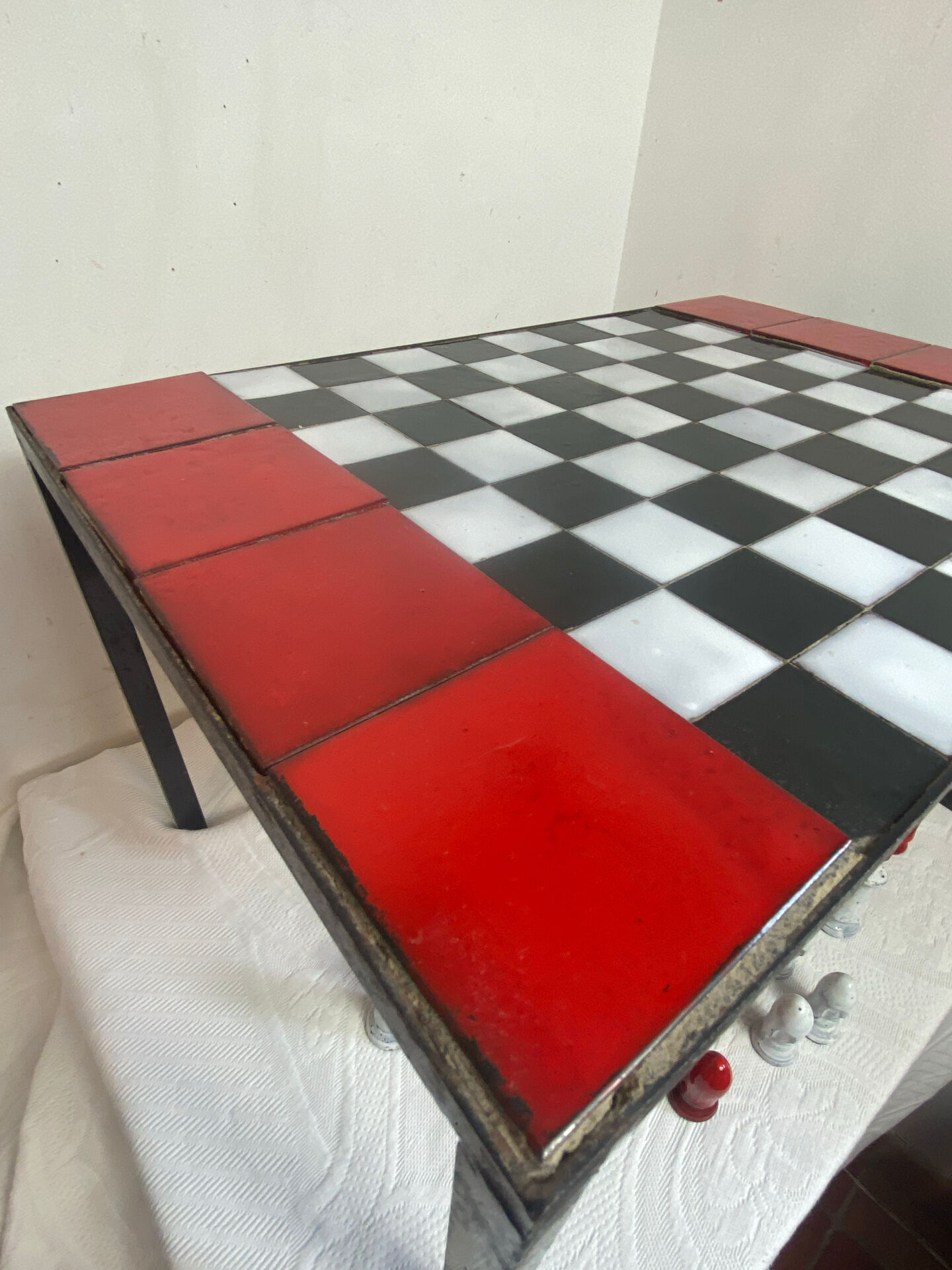 Chess set with ceramic board and pieces.