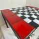 Chess set with ceramic board and pieces.