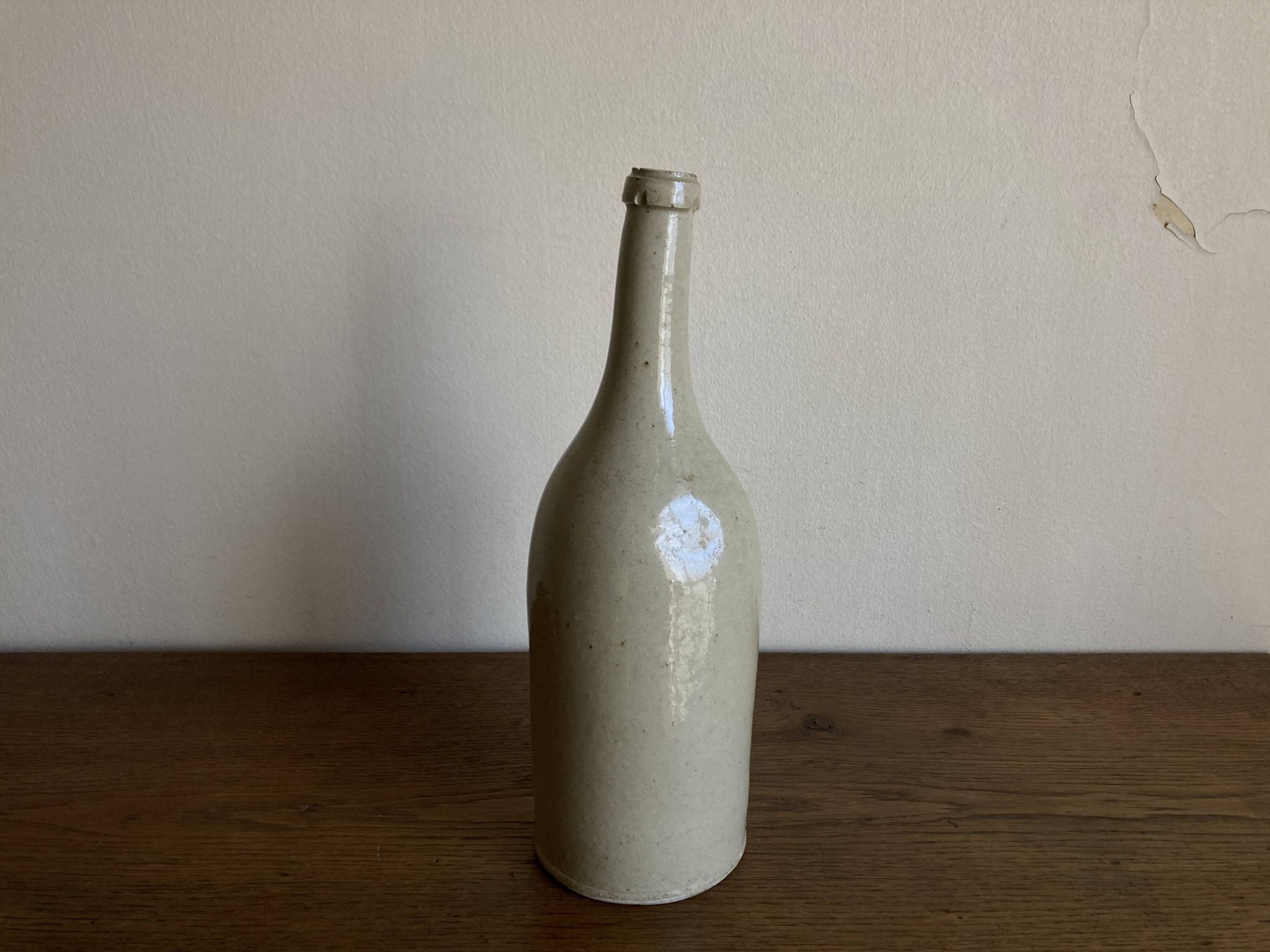 Bouteille de grès penchée début 20e