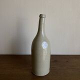 Stoneware bottle tilted at an angle, early 20th century