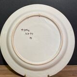 Large earthenware dish signed with bird decoration