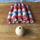 Former wooden tricolor bowling game with its ball