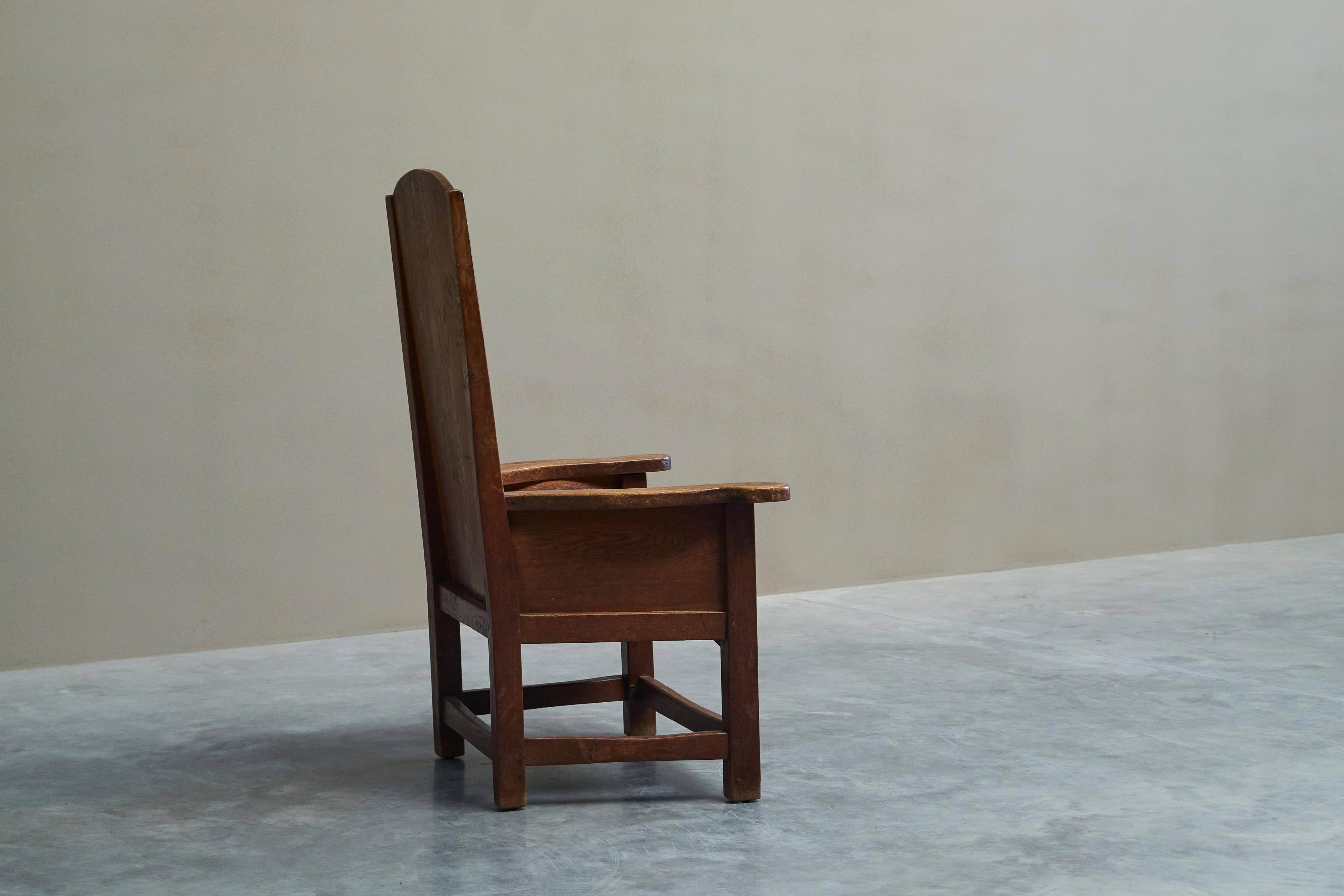 Antique solid oak armchair, 19th-century farmer style.