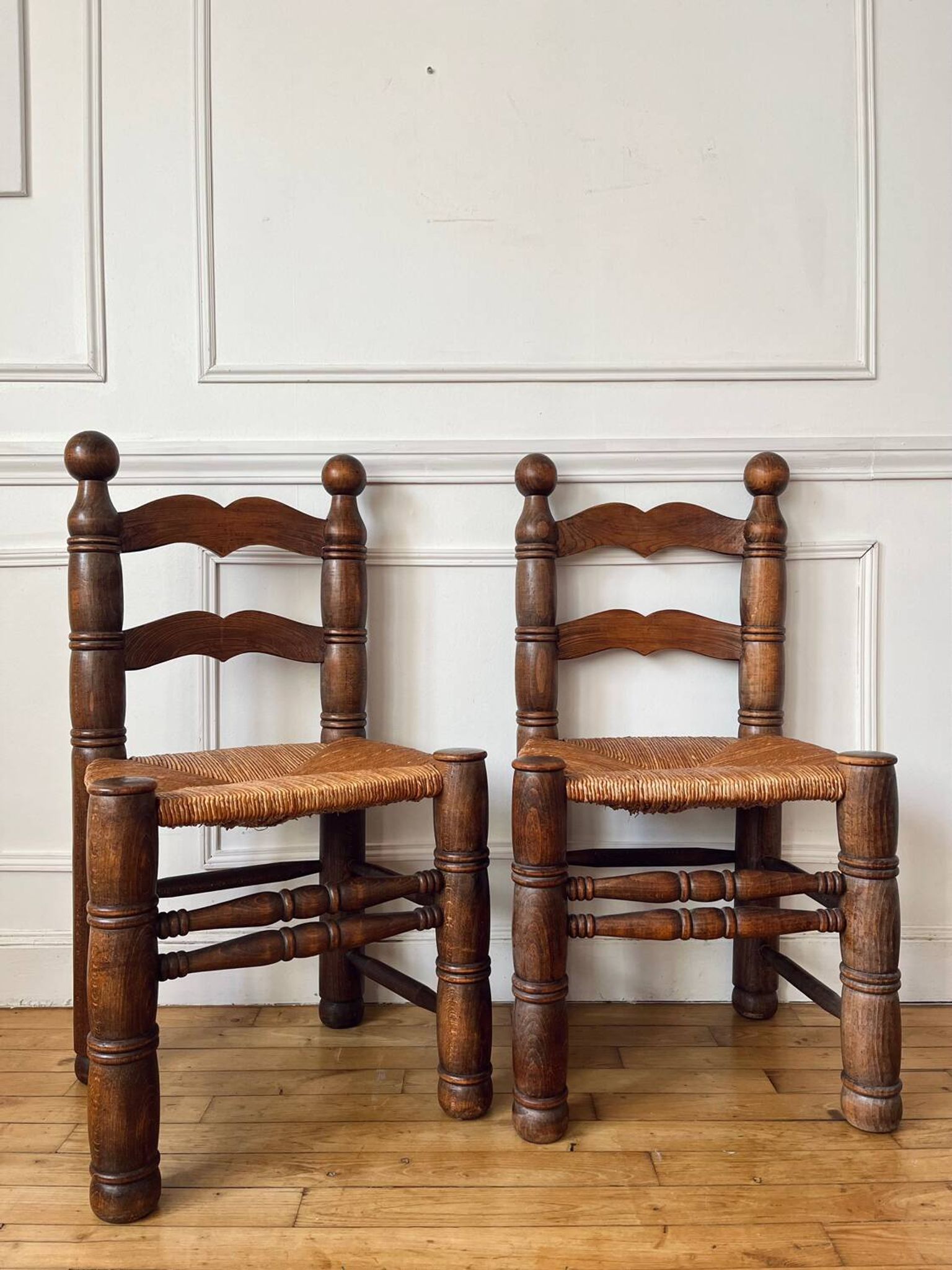 Pair of rustic chairs in the style of Charles Dudouyt.
