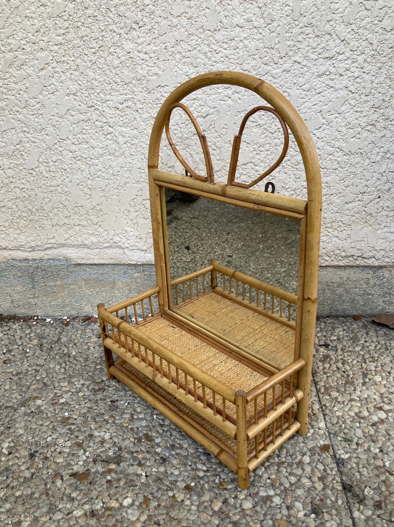 Vintage rattan wall shelf with mirror