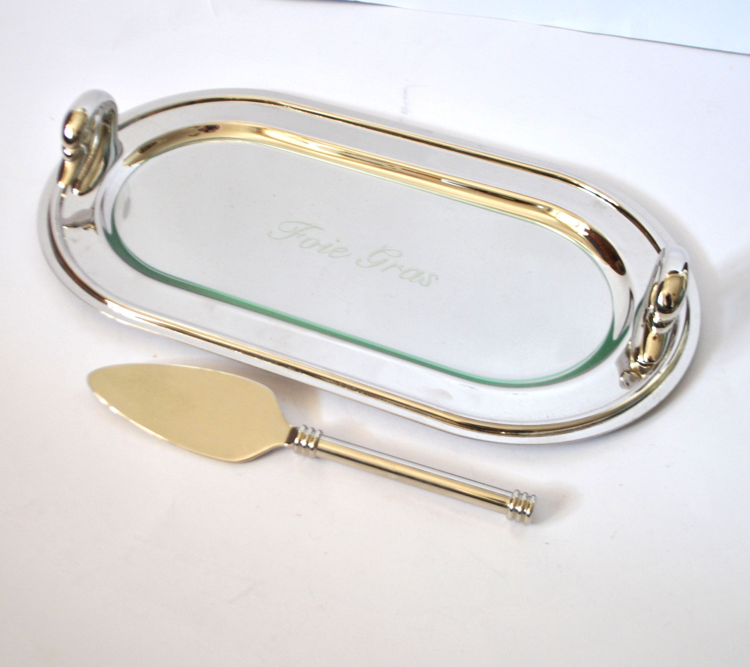 Vintage silver-plated foie gras platter with goose head decoration and serving spatula.