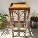 Vintage rattan plant stand in Art Deco style