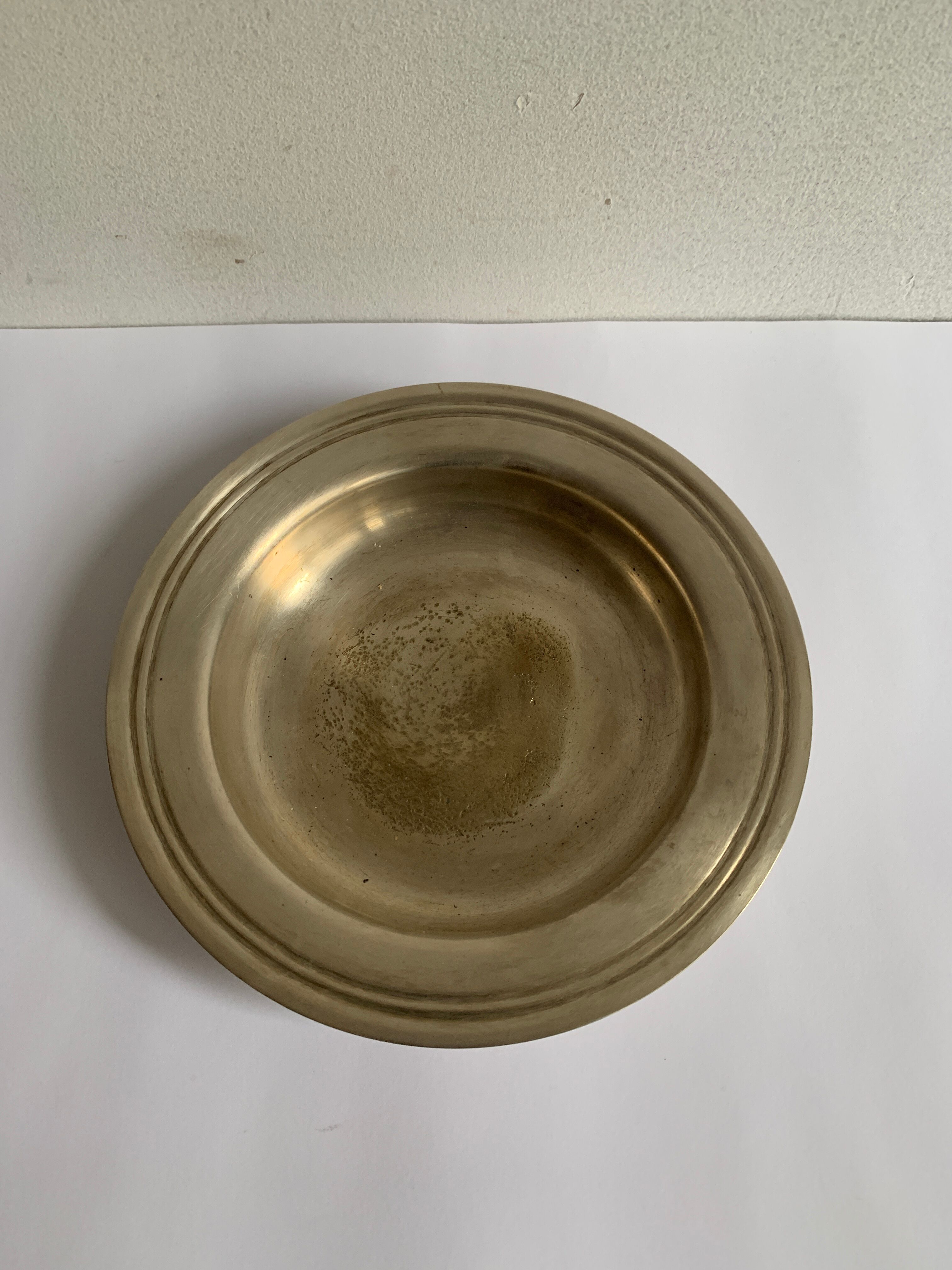 Empty brass pocket cup