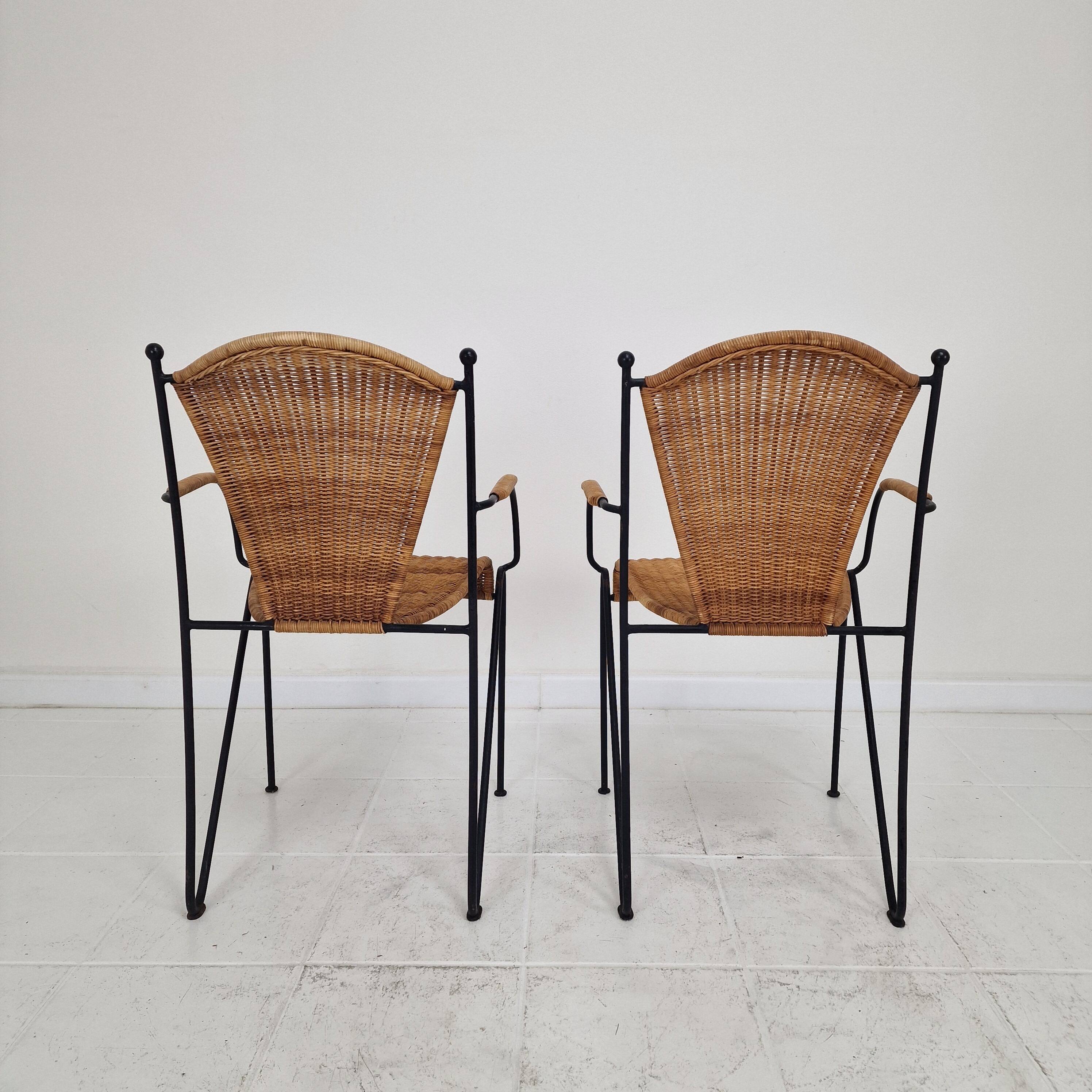 Pair of wicker and iron armchairs by Frederic Weinberg, United States, 1950s.