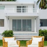 Pair of rattan armchairs with fan patterns