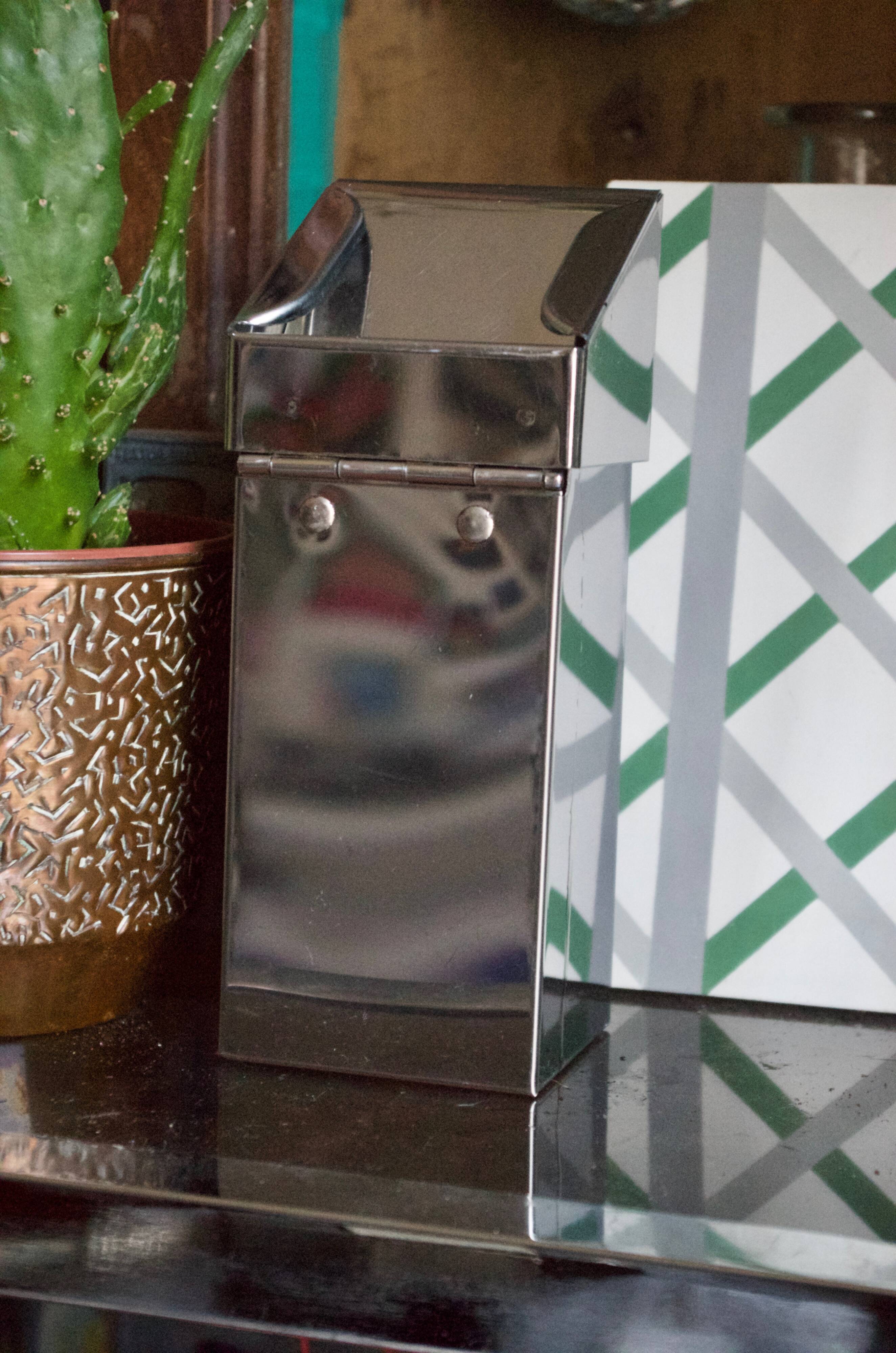 Vintage wall ashtray in shiny metal industrial style