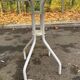 Round bistro table in steel with tulip base and glass top, 60cm