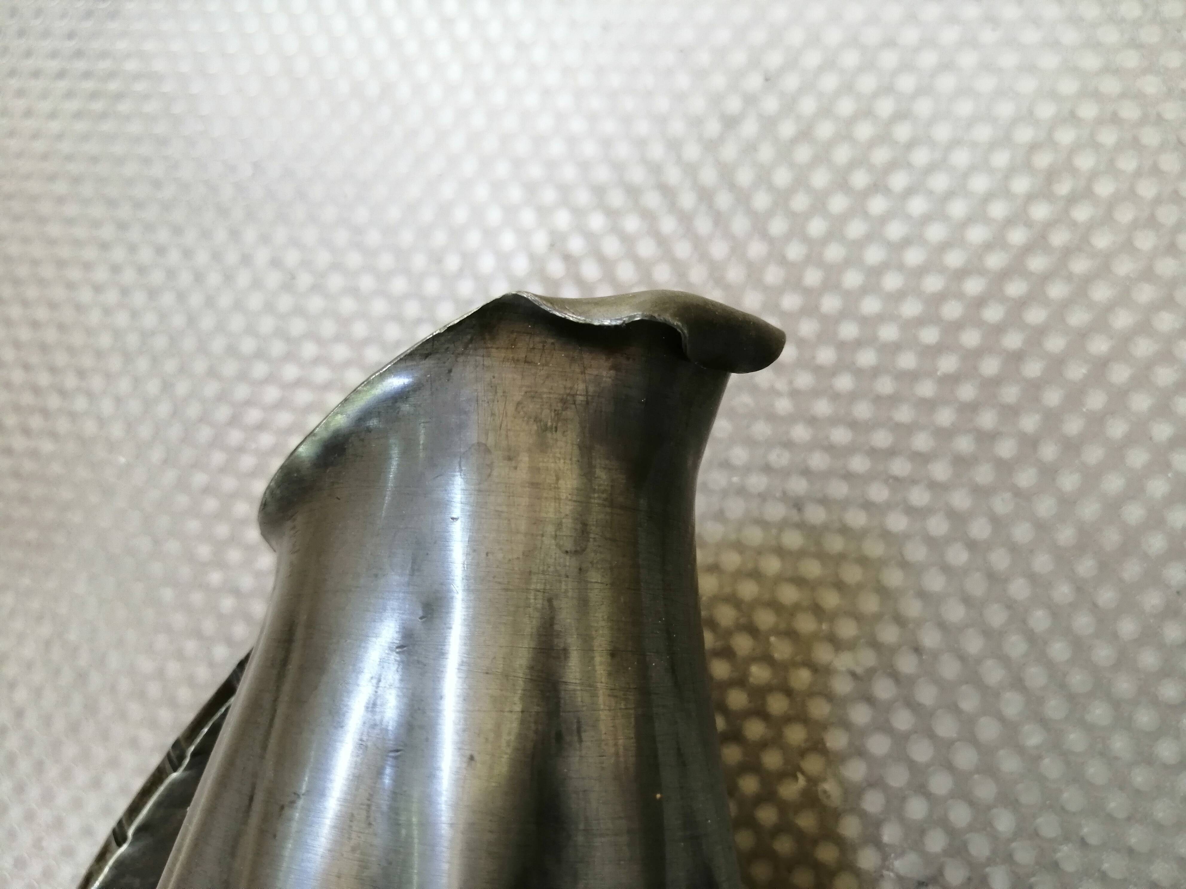 Tin pitcher signed and dated 1922