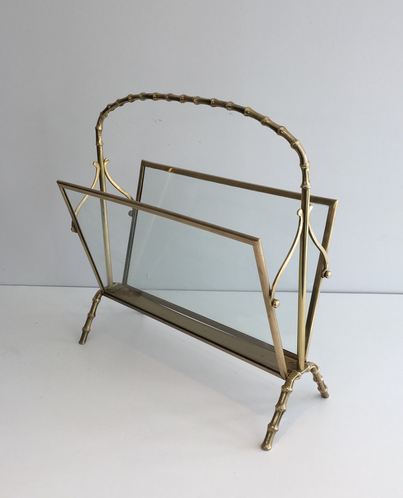 Bamboo-style brass magazine rack from the Baguès house.