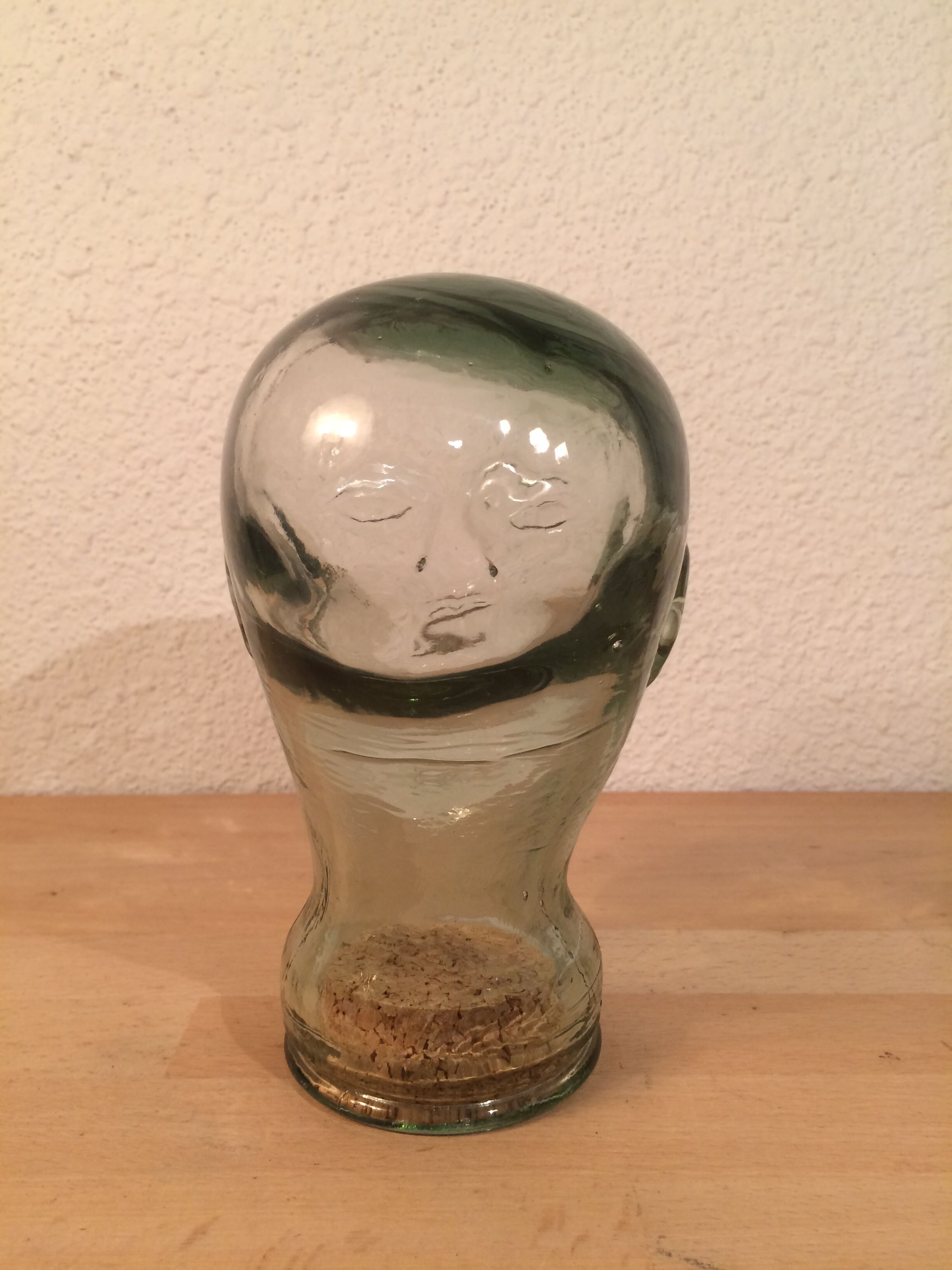 Molded glass head curiosity cabinet