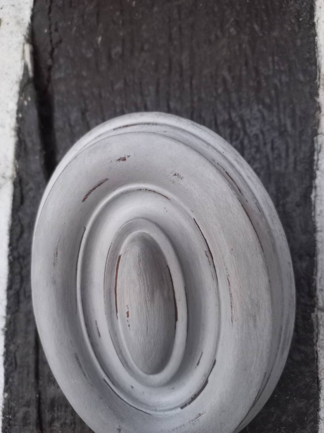 Pair of patinated oval woodwork