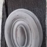 Pair of patinated oval woodwork