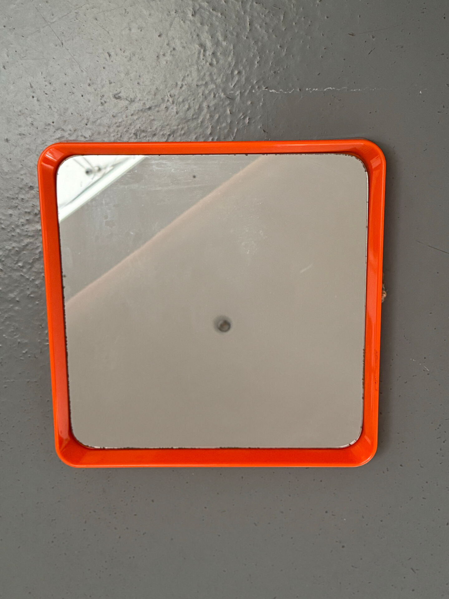 Orange moulded plastic mirror