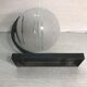 Vintage wall sconce ball-shaped glass reflector and black metal sconce