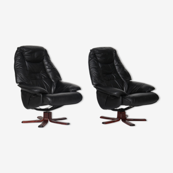 Pair of Danish black leather recliner swivel chairs by Hjort Knudsen