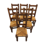 6 Solid oak dining chairs seated in straw
