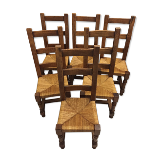 6 Solid oak dining chairs seated in straw