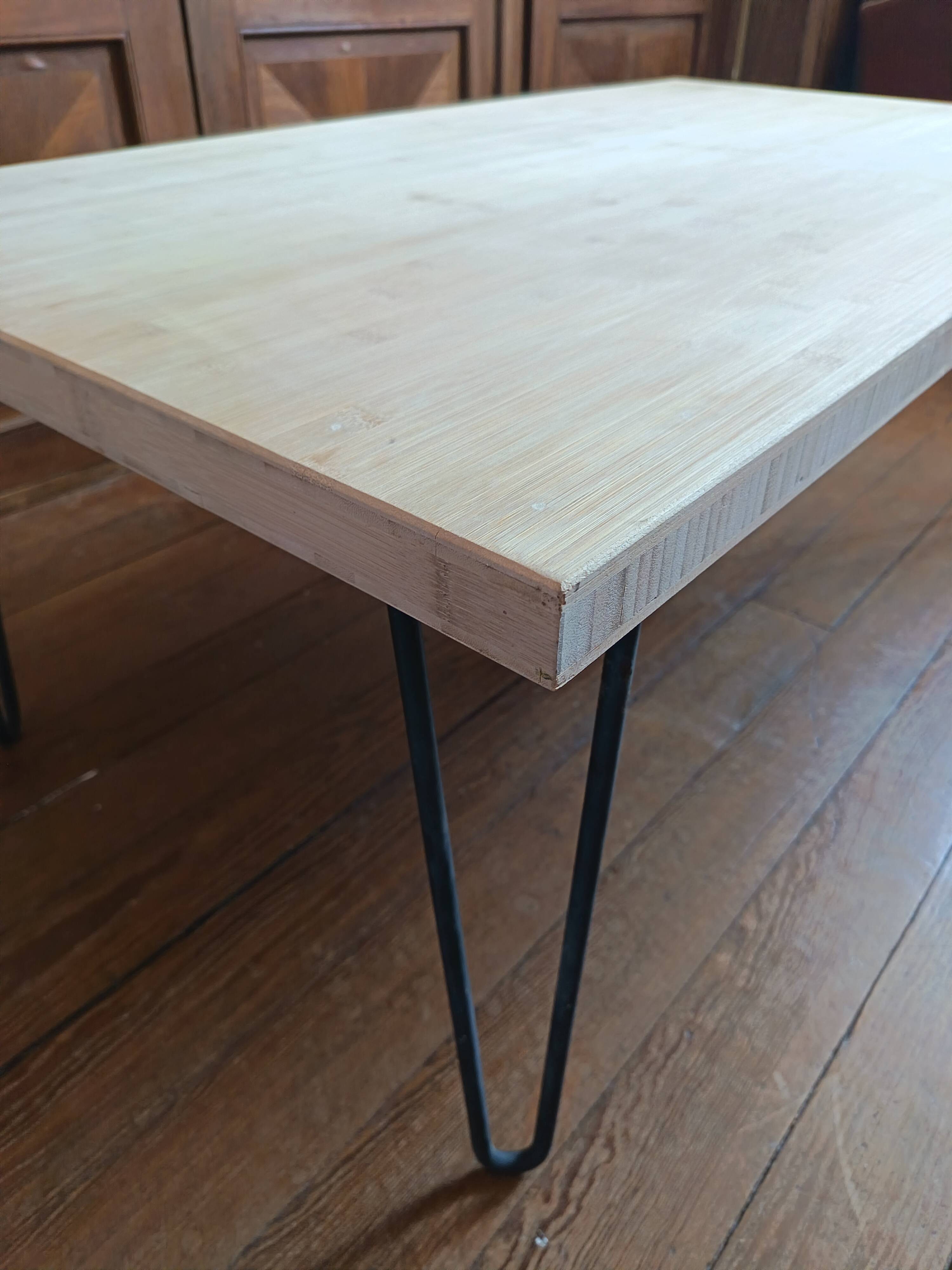 Coffee table in solid bamboo with steel legs.