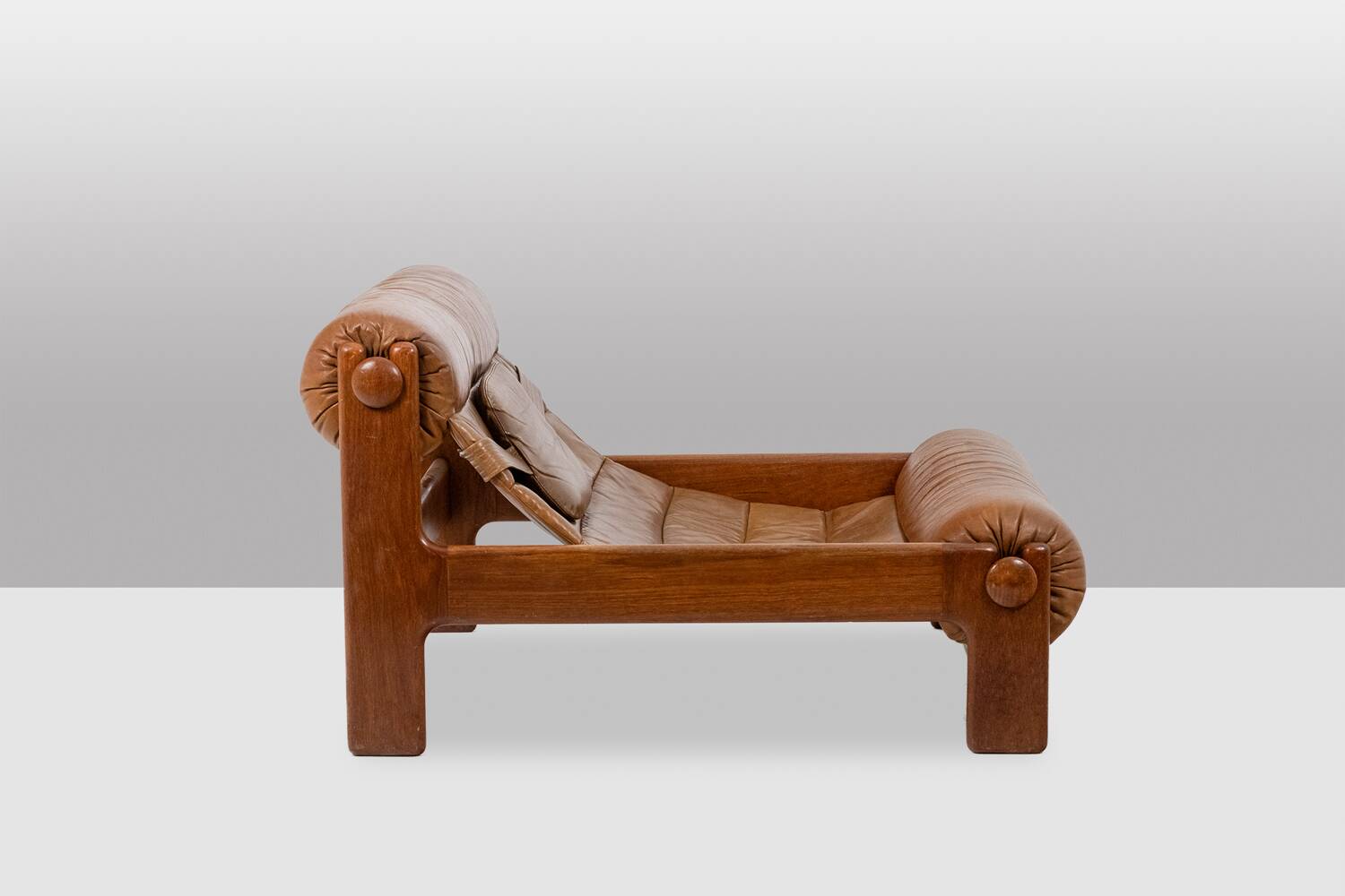 Lounge chair and ottoman, in blond elm and leather. 1970s