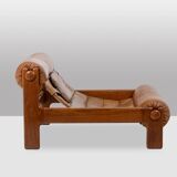 Lounge chair and ottoman, in blond elm and leather. 1970s