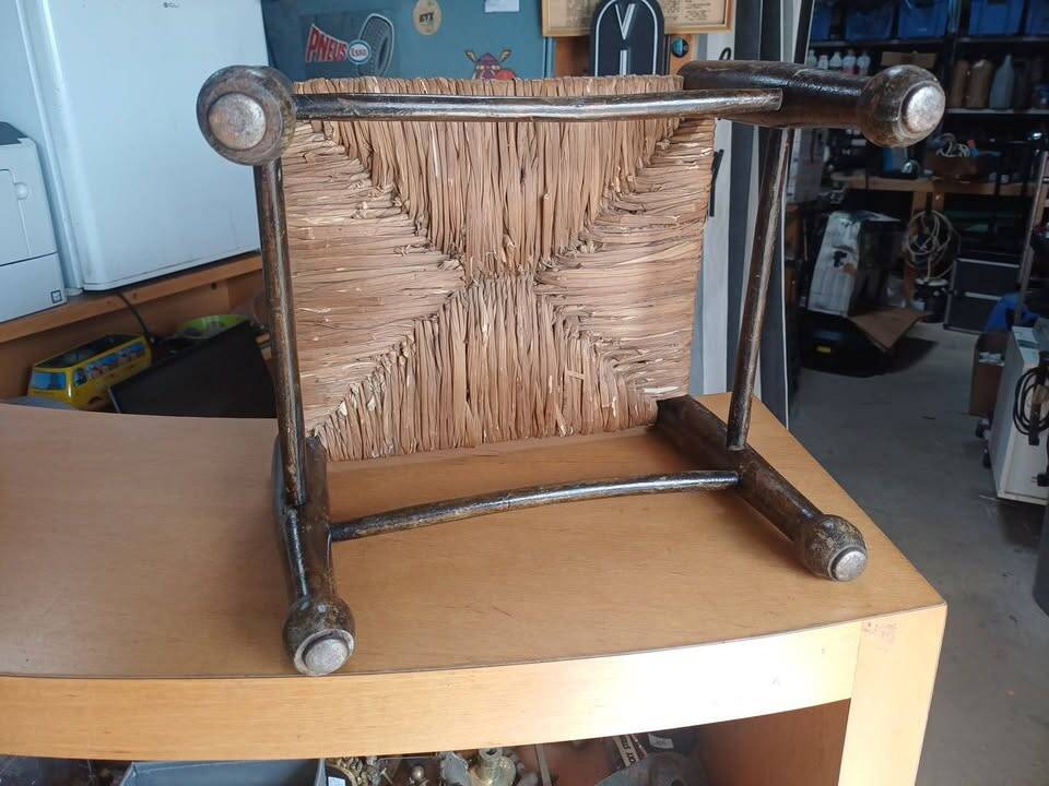 Small rustic vintage stool in wood and straw.