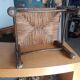 Small rustic vintage stool in wood and straw.