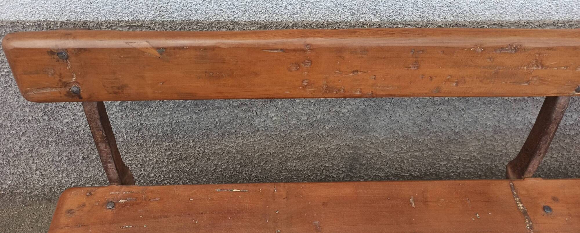 Old wooden bench with cast iron base