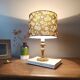 brass table lamp | khaki lampshade with multicoloured daisies