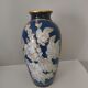 Cobalt blue porcelain vase from Limoges, France with floral pattern.