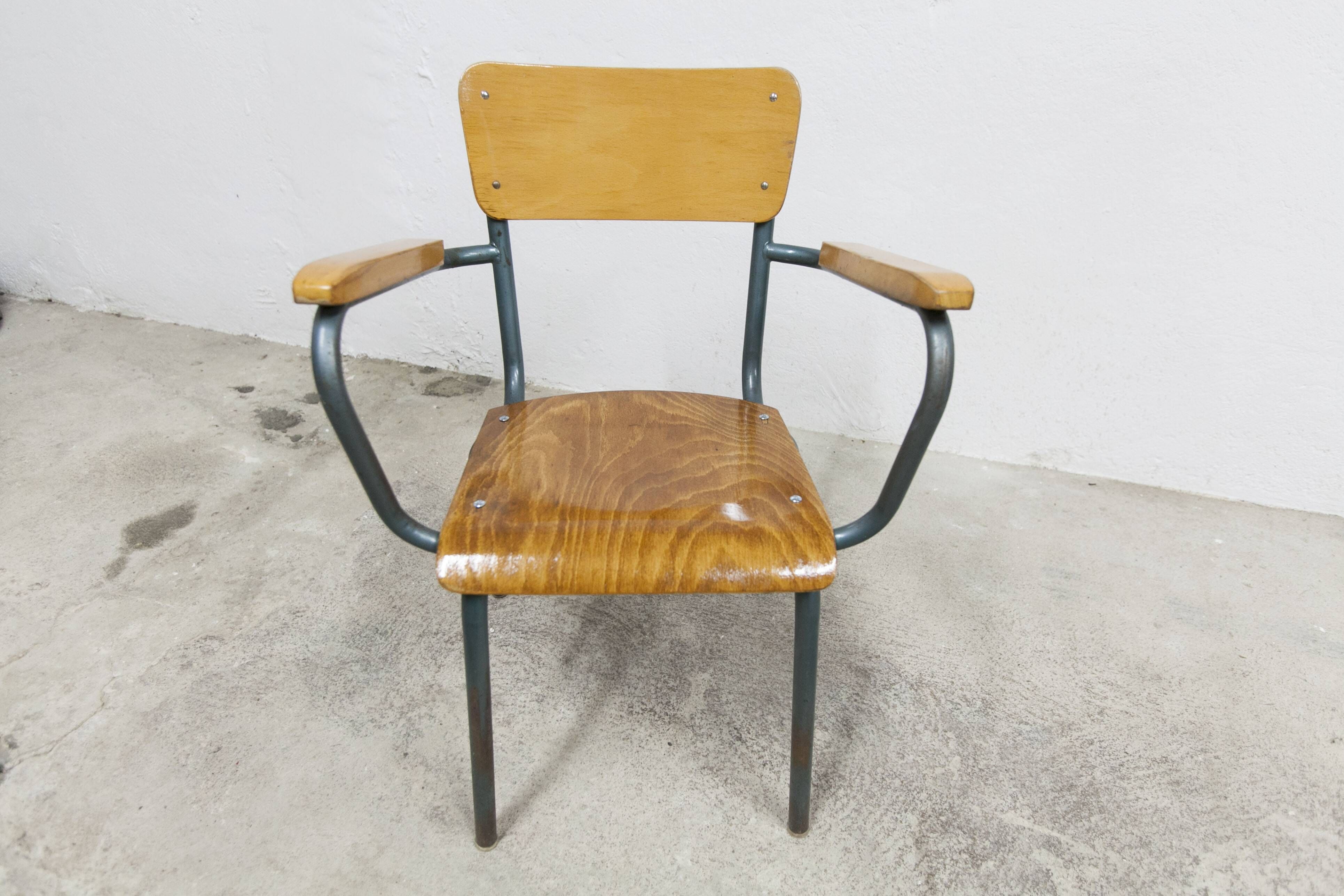 1962 school teacher's chair in honey color and tubular structure
