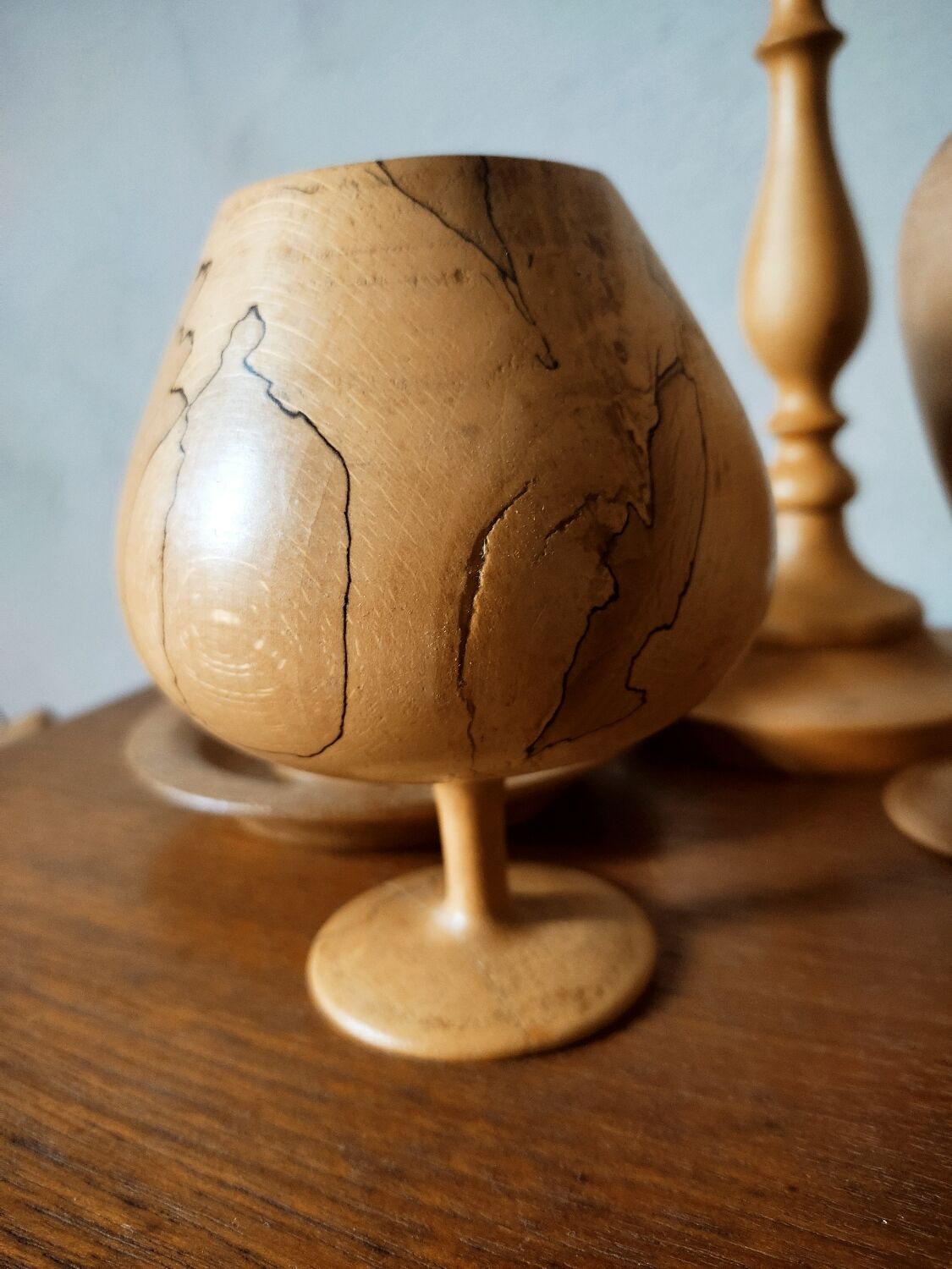 Composition of vases and cups in turned wood