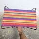 Vintage folding stool with a bayadère fabric pattern.